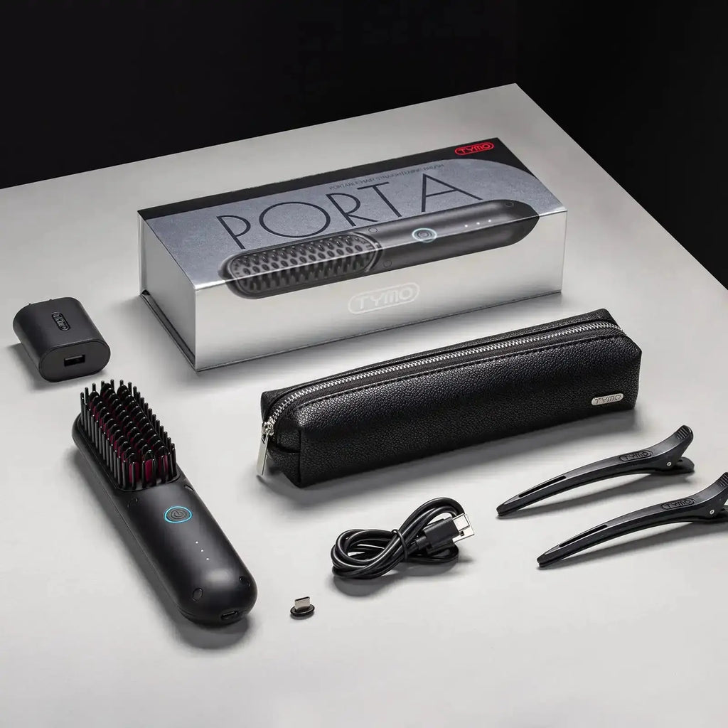 Complete packaging of TYMO PORTA cordless hair straightener with accessories including USB cable and travel pouch.